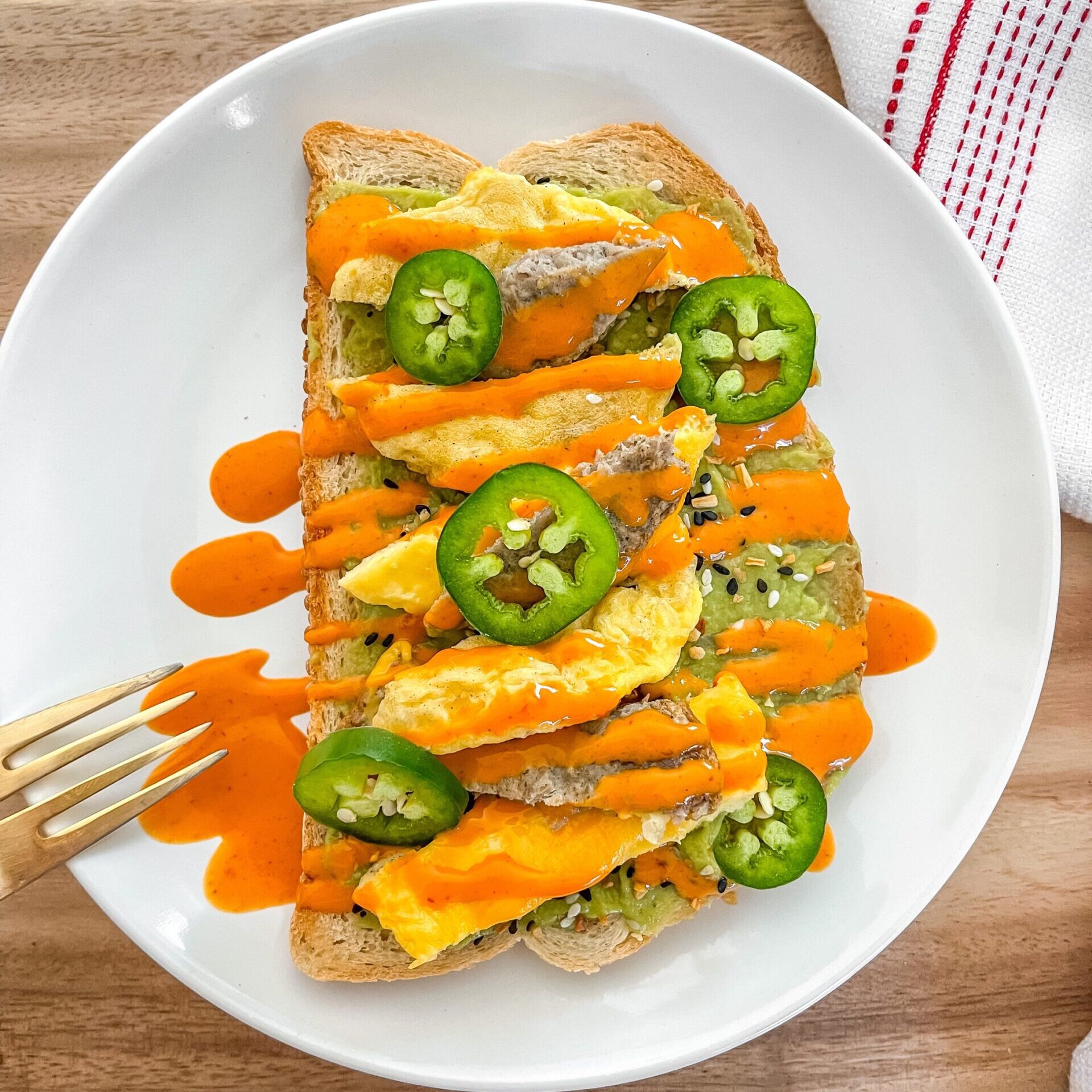 Egg'Wich Avocado Toast on plate with fork